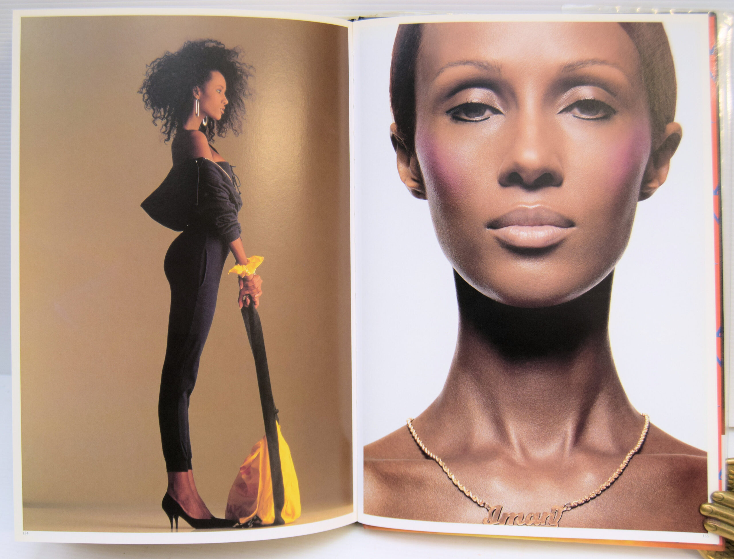 IMAN: Her first book is a gloriously entertaining hybrid essay on the cultural-cum-political power of good looks. A quarter century of the most famous photographs by Helmut Newton, Steven Meisel, Herb Ritts, Peter Lindbergh, Bruce Weber, Scavullo, David Bailey, Nick Knight, and many others are contextualized by well-known essayists, a chorus of celebrity contributions, and Iman's own take on her much-mythologized career. The book's outrageous pop design--by graphic designers Barnbrook Studios--makes it plain that this is not just one woman's success story. "I Am Iman" captures the funny, infuriating, and often absurd validation of black and ethnic looks in a beauty industry where billions of dollars--and the self-image of women everywhere--are on the line. Peeks behind the curtain and scintillating interviews are courtesy of feminist critic bell hooks, "Interview" editor Ingrid Sischy, model and manager Bethann Hardison, and such celebrities as Cindy Crawford, Yves St. Laurent, Naomi Campbell, Bruce Weber, Tyra Banks, and many more. With graphic design featuring gatefolds, diecuts, and other interactive elements, as well as specially commissioned, never-before-seen images by Annie Leibowitz, Ellen Von Unwerth, Sante D'Orazio, and Michel Comte, this book is an assemblage worthy of any fashionista's dream. - Image 5